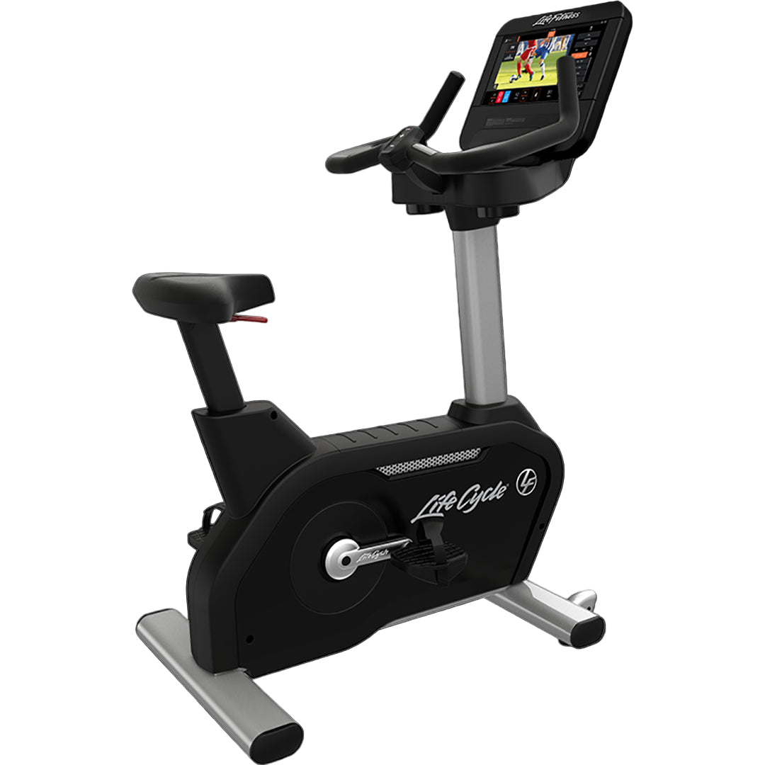 Black exercise bike with digital display on a white background