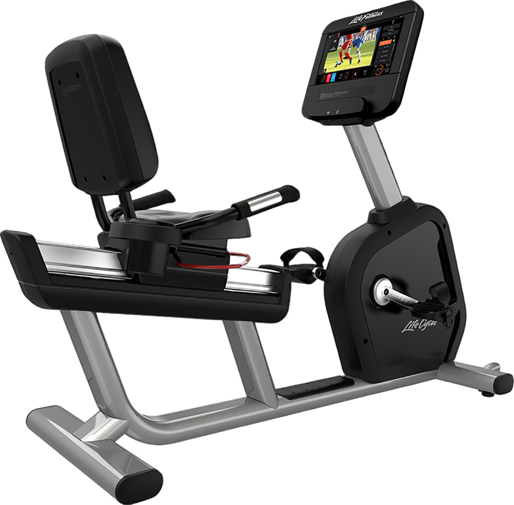 Recumbent bike with a screen displaying a workout program on a black background
