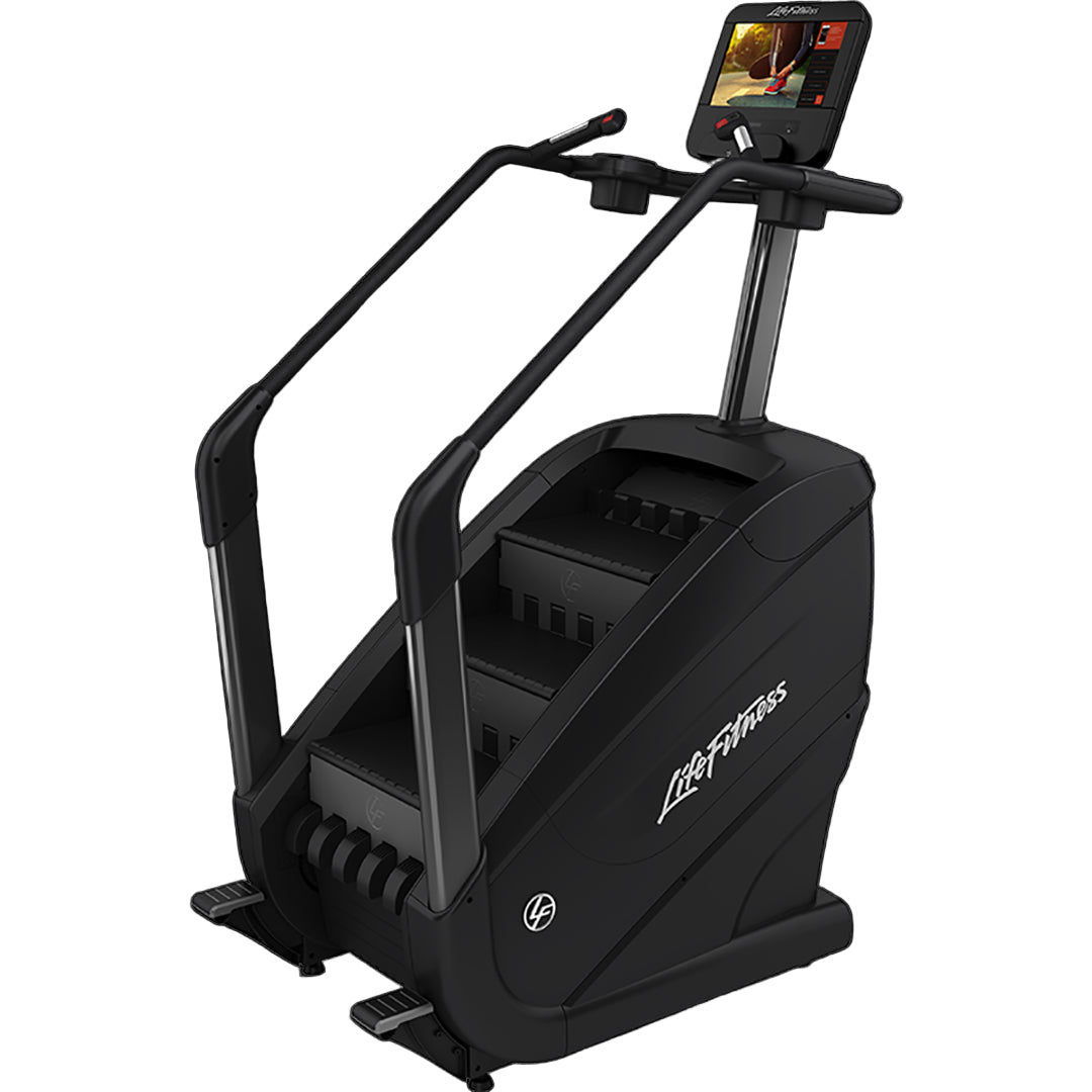 Black exercise bike with digital display on a white background
