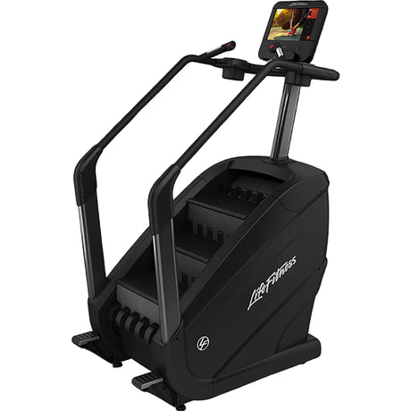 Black exercise bike with digital display on a white background