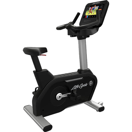 Black exercise bike with digital display on a white background
